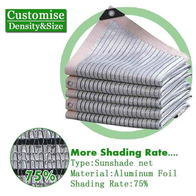 Silvery aluminum foil sunshade net, folded with grommets; 75% shading rate.