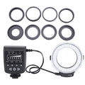 FC100 macro ring flash with controller unit and eight black circular adapter rings for camera lens mounting.