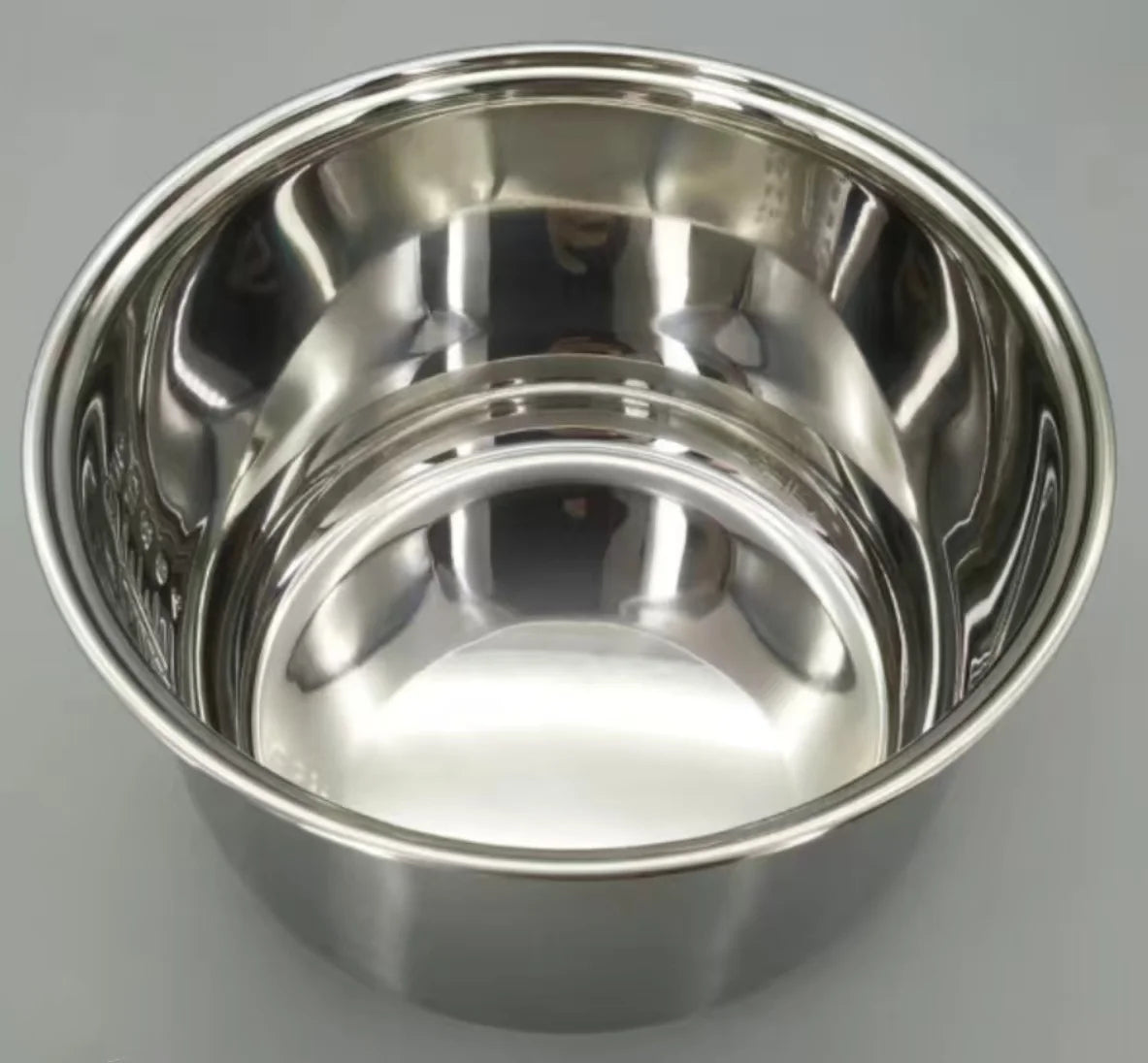 Stainless steel rice cooker inner pot interior with polished walls