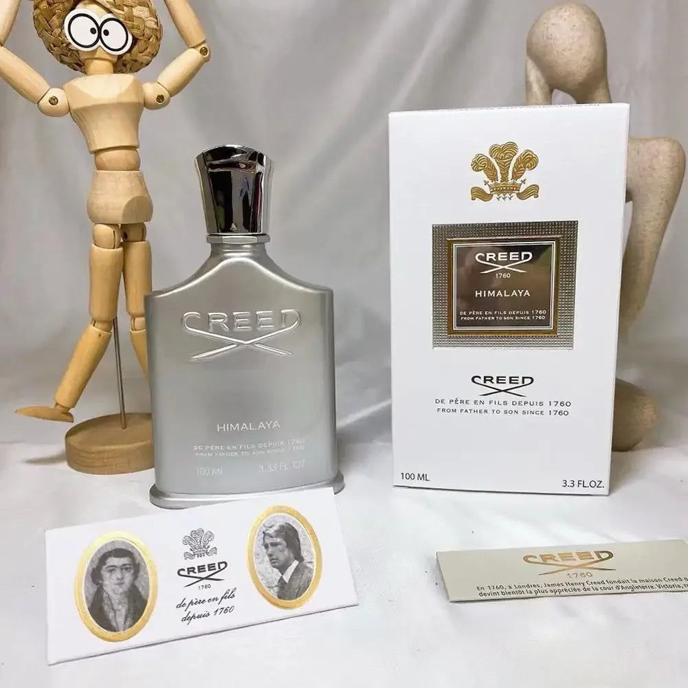 Creed Himalaya EDP for men: metallic silver bottle, iconic branding, 100ml spray with box. Luxurious unisex fragrance.