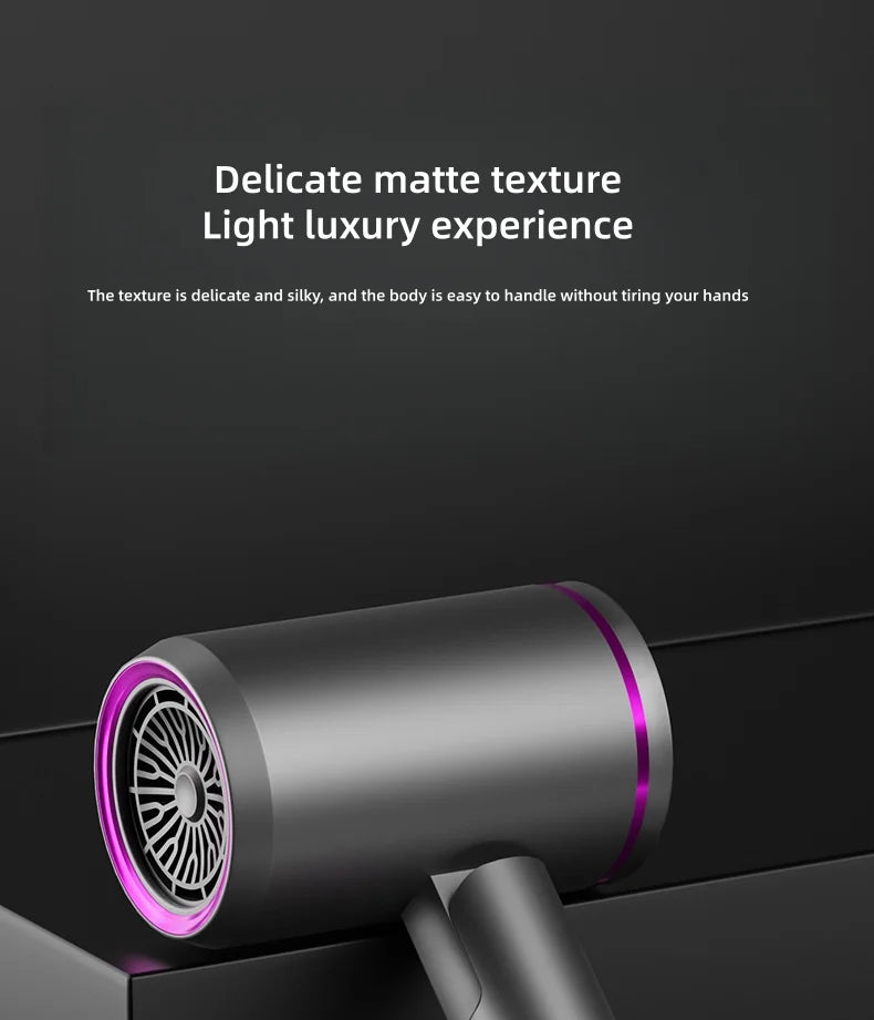 Matte grey 2400W foldable hair dryer with purple accents, silent motor, and nozzle for professional styling.