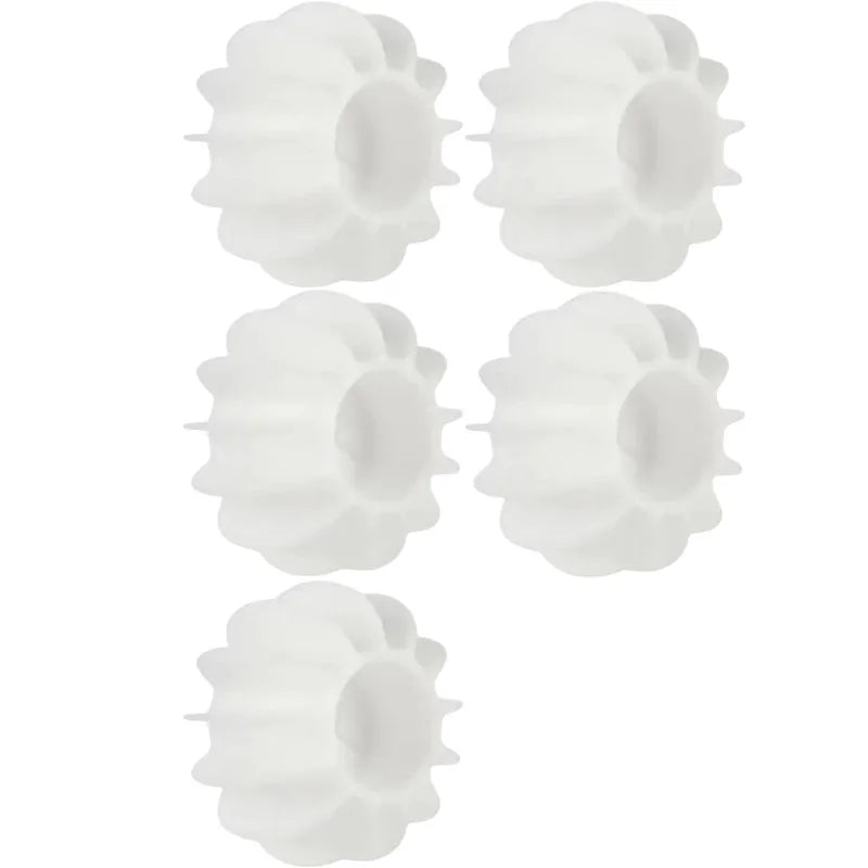 White silicone laundry balls for removing pet hair and lint from clothes in the washing machine.