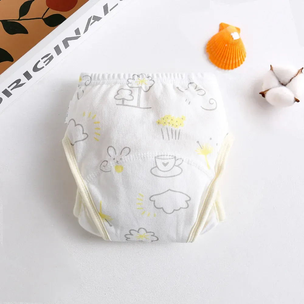 Cotton baby training diaper with cute yellow nature and animal print, soft breathable absorbent baby care garment.