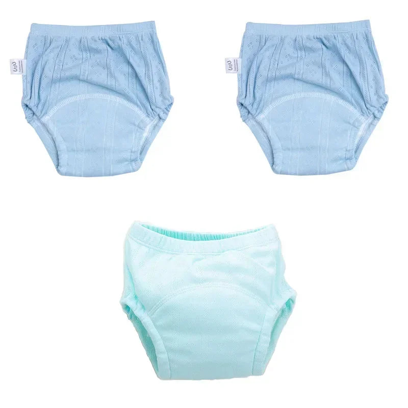Three-pack of U&U baby potty training diapers in blue and teal colors, soft fabric design for toddler care.