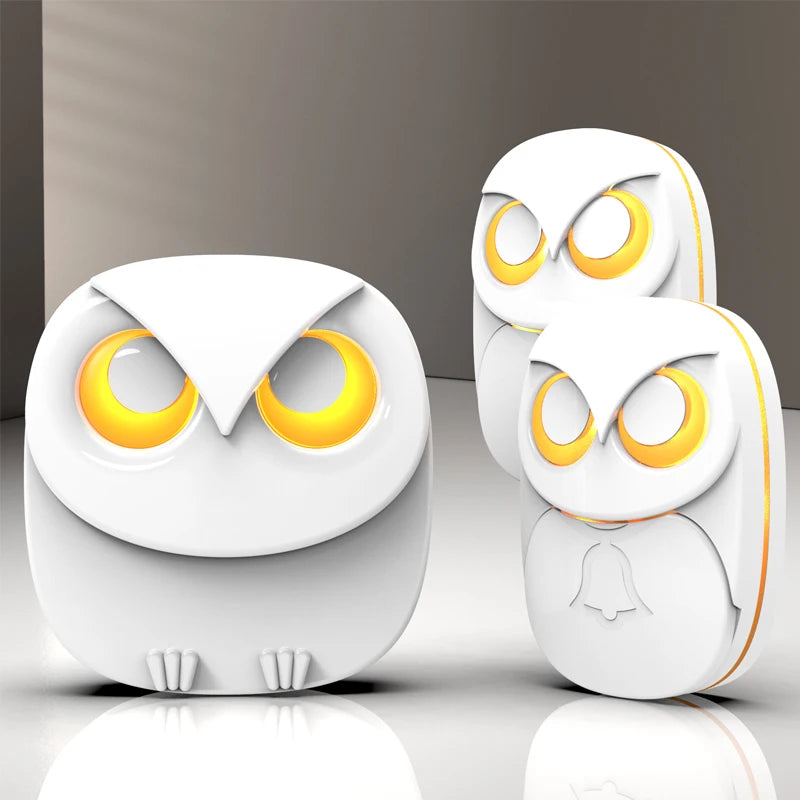 Wireless doorbell chime set with two white owl-style chime units, glowing yellow eyes and bell icon