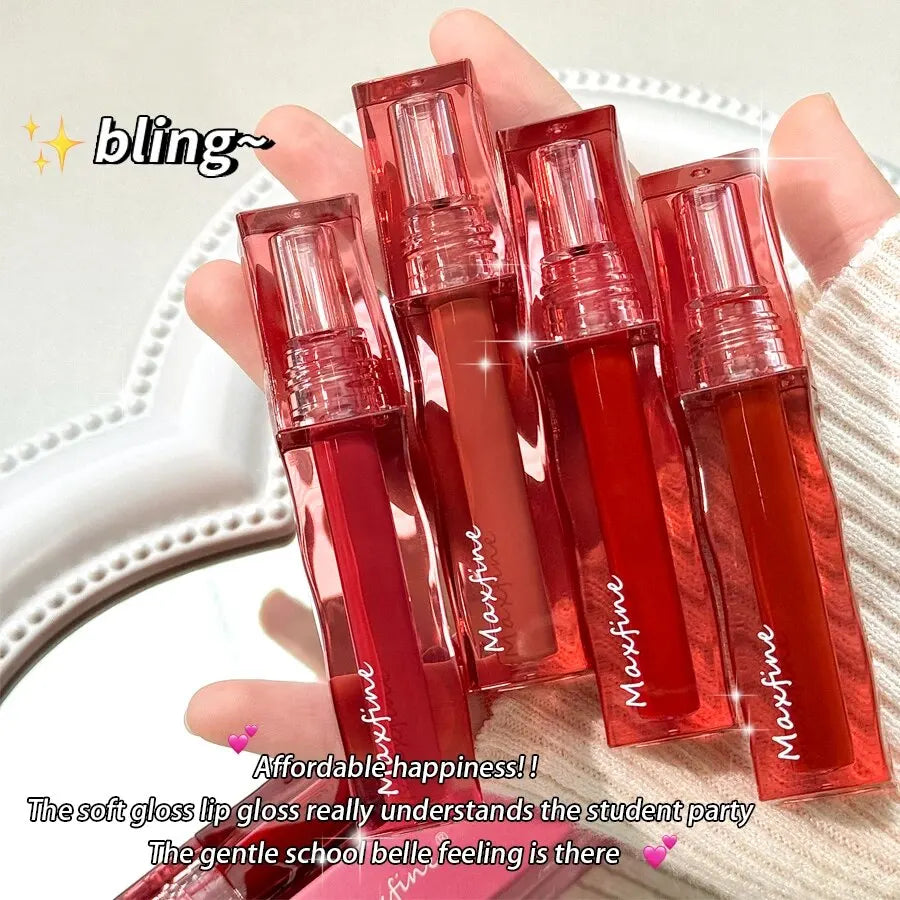 Four highly pigmented Maxfine liquid lipsticks in red, orange, and pink shades with a waterproof, moisturizing finish.