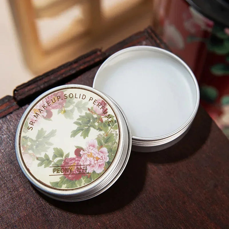 Tidesmit portable solid perfume balm for women featuring fresh long-lasting fragrance in a compact elegant tin.