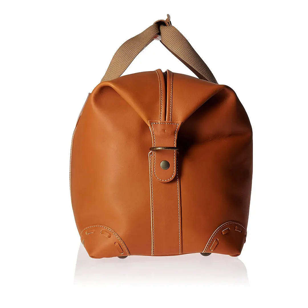 Tan PU leather travel trunk duffel bag with canvas handles, side shoe compartment, and vintage-style stitched corners.