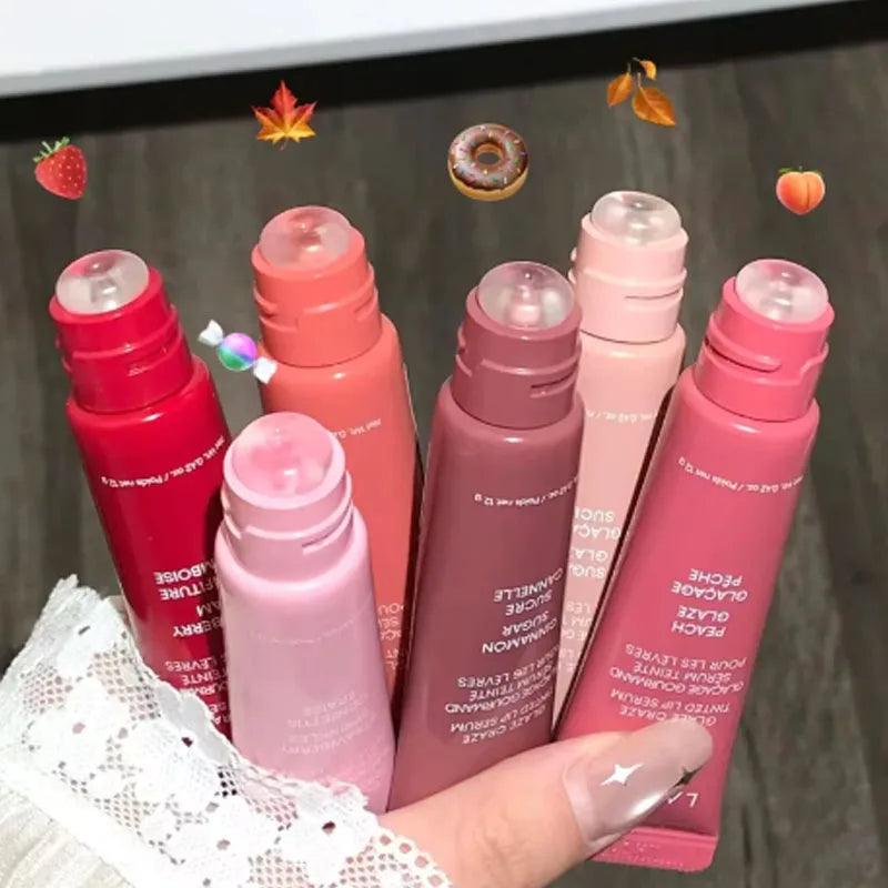 Laneige Lip Glowy Balm set in assorted tinted shades, offering glossy, hydrating lip care with a smooth applicator tip.