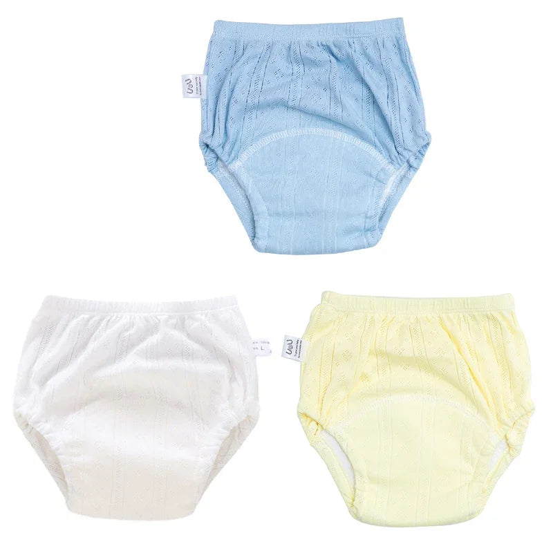 Set of 3 UoU baby potty training diapers, size L. Breathable, cotton-like fabric in blue, white, and yellow colors.