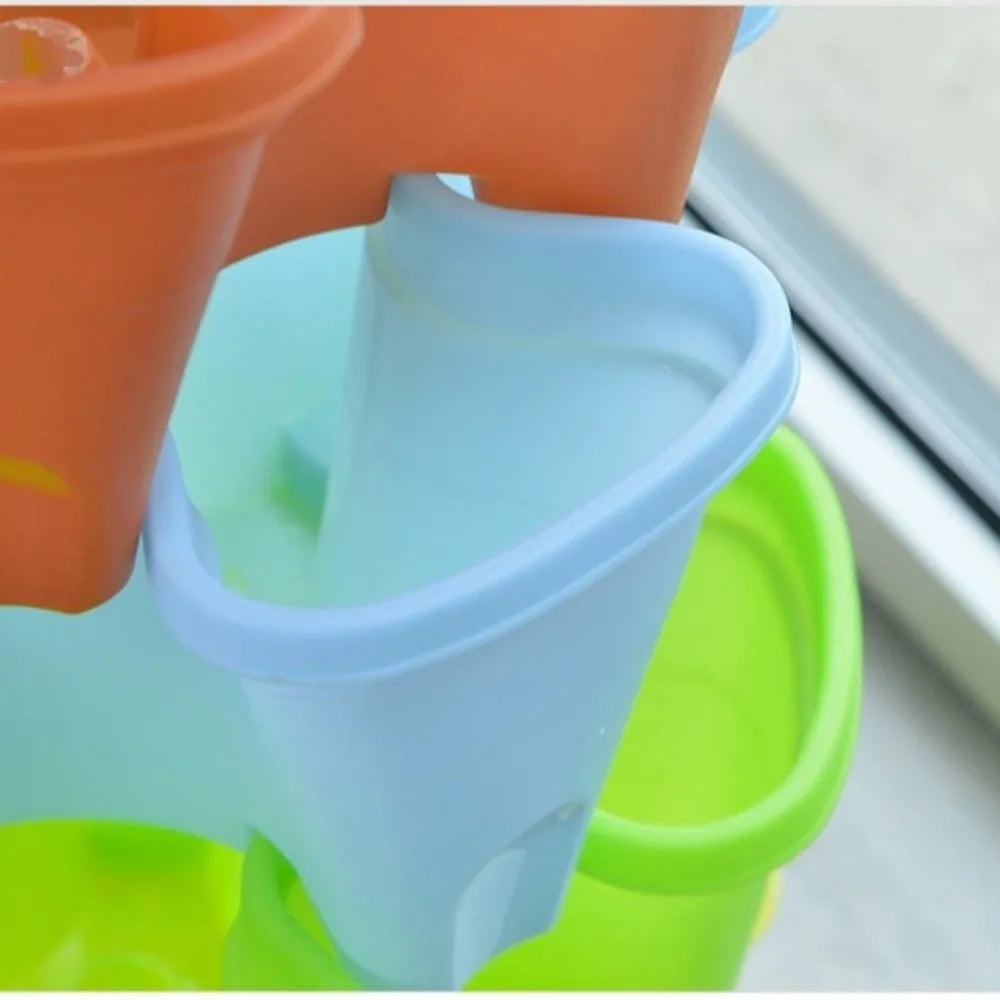 Light blue and green tiered plastic planter set with stacked raised compartments