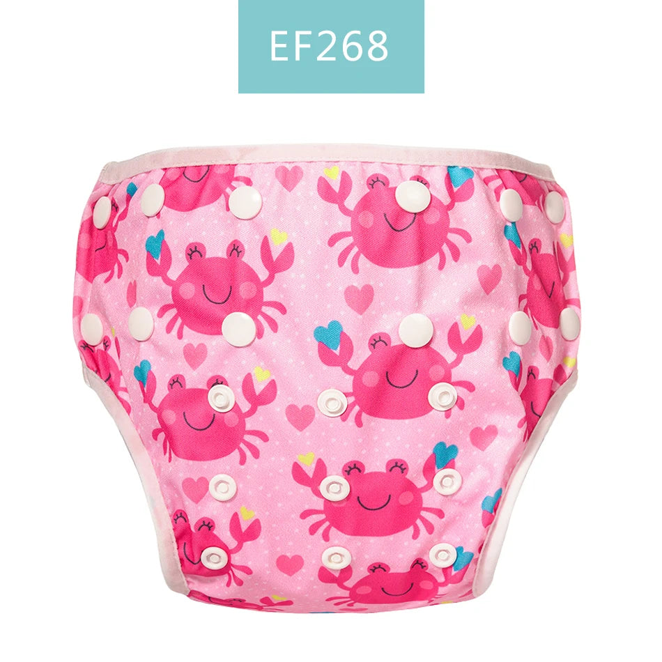 Reusable baby swim diaper, EF268 style, featuring a cute pink crab and heart pattern with adjustable snap closures.