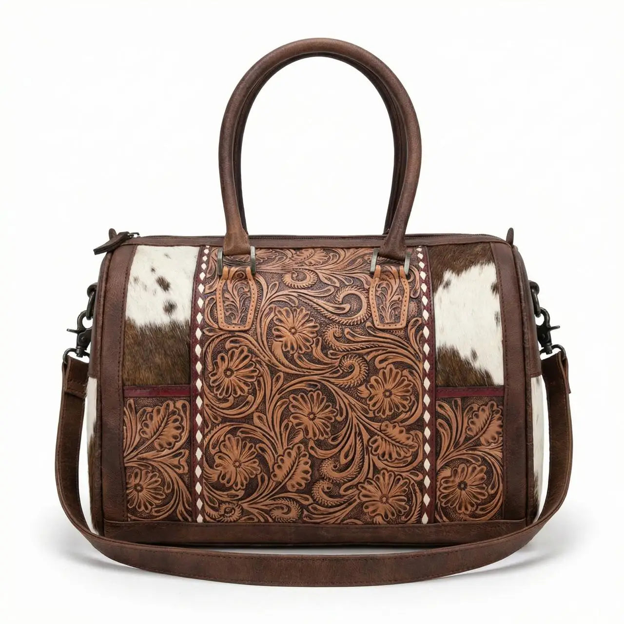 Brown leather mini duffel bag with floral tooling, cowhide panels, top handles, and a detachable shoulder strap.