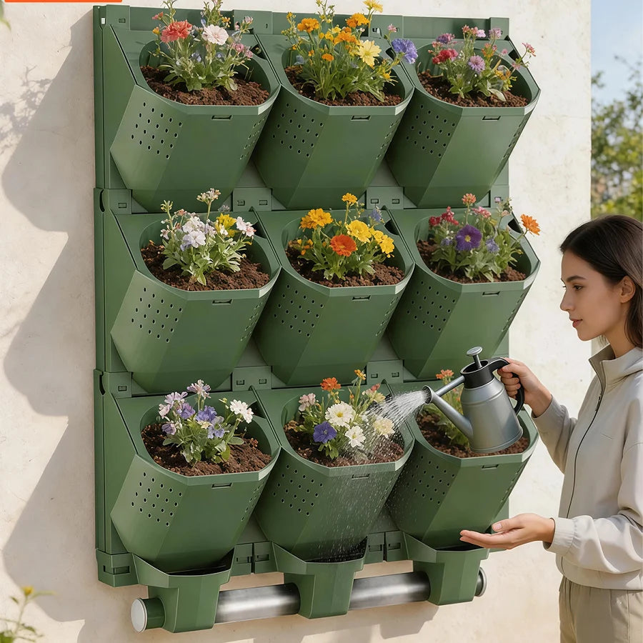 Green modular vertical garden planter wall holding assorted flowering plants and cups