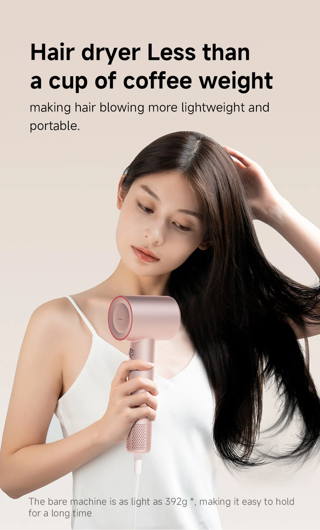 Woman using a lightweight, pink DOCO high-speed hair dryer with 110,000 RPM motor for professional home hair care.