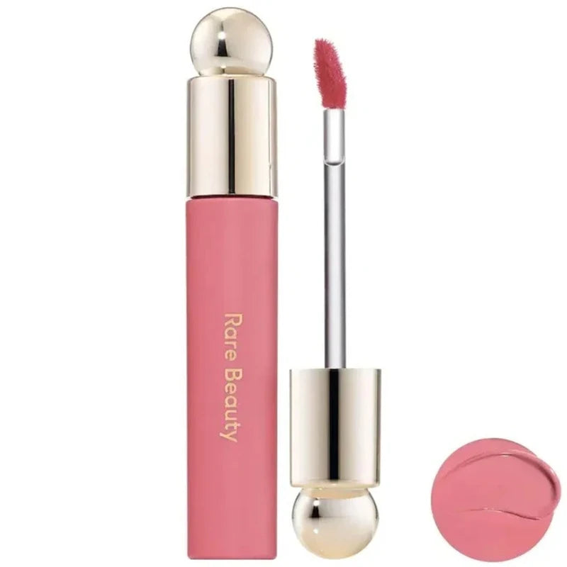 Rare Beauty Soft Pinch Tinted Lip Oil with applicator wand, showcasing a glossy, moisturizing pink lip stain texture.
