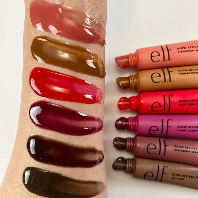 e.l.f. Glow Reviver Lip Oil swatches showing glossy, moisturizing textures in vibrant pink, red, and brown shades.