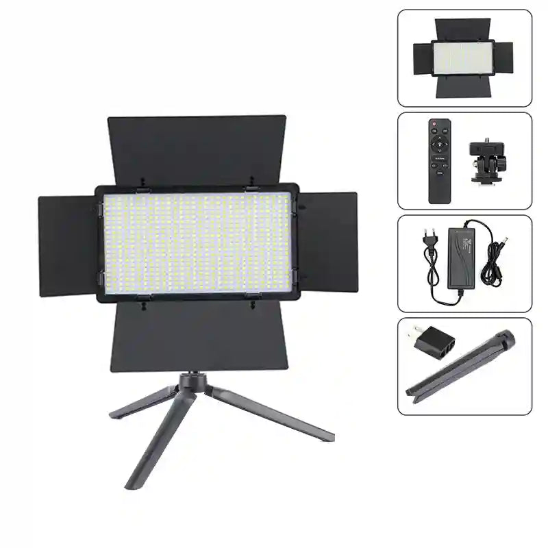 Rectangular LED video light with black barn doors on a mini tripod, including remote control, power adapter, and mount.