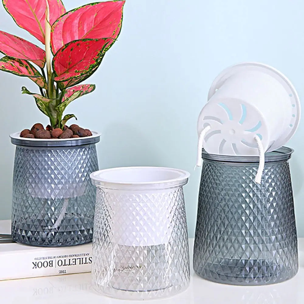 Self-watering plastic plant pot set with clear reservoir window and textured gray planter