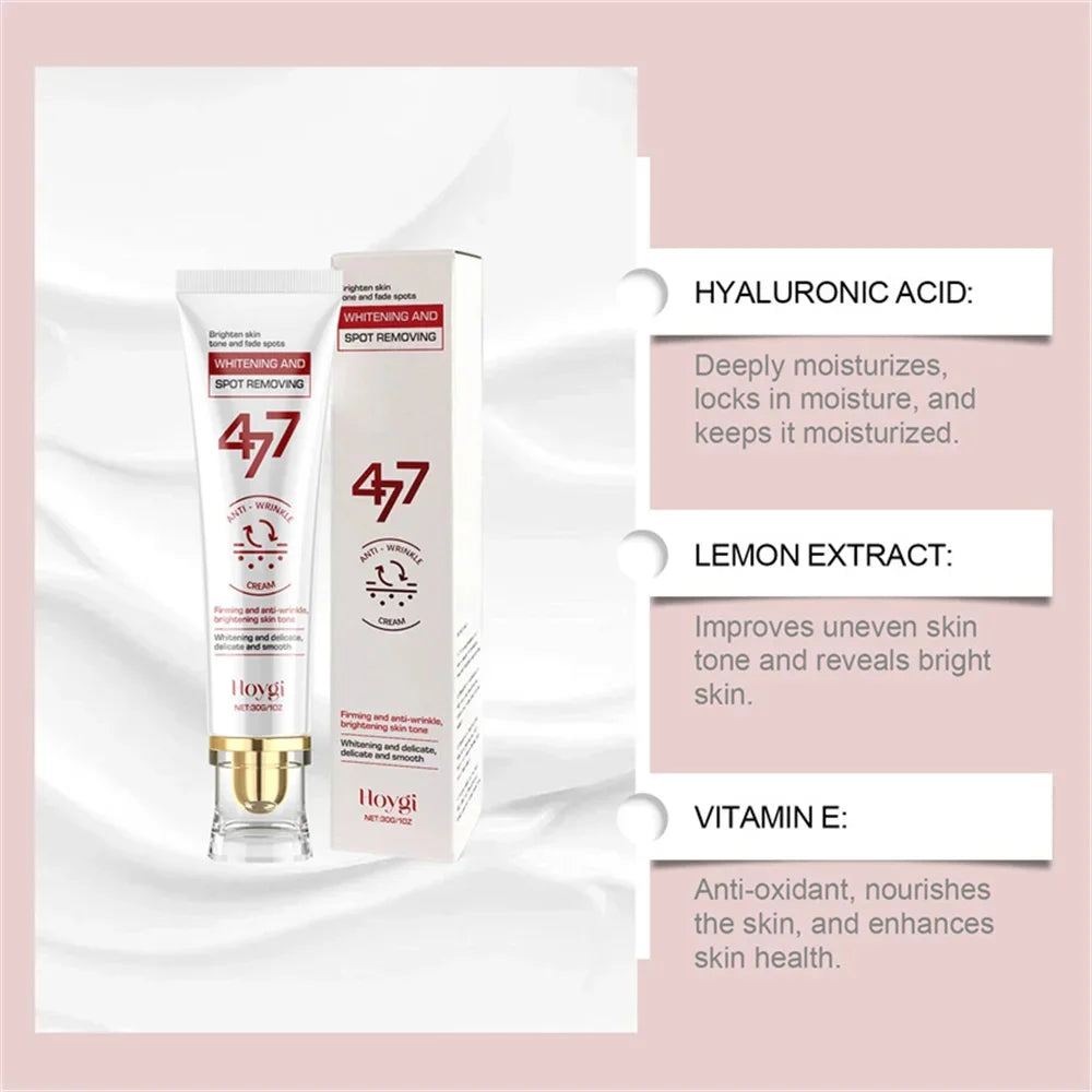 White and gold whitening and spot removing cream tube and box with hyaluronic acid, lemon extract, and vitamin E.