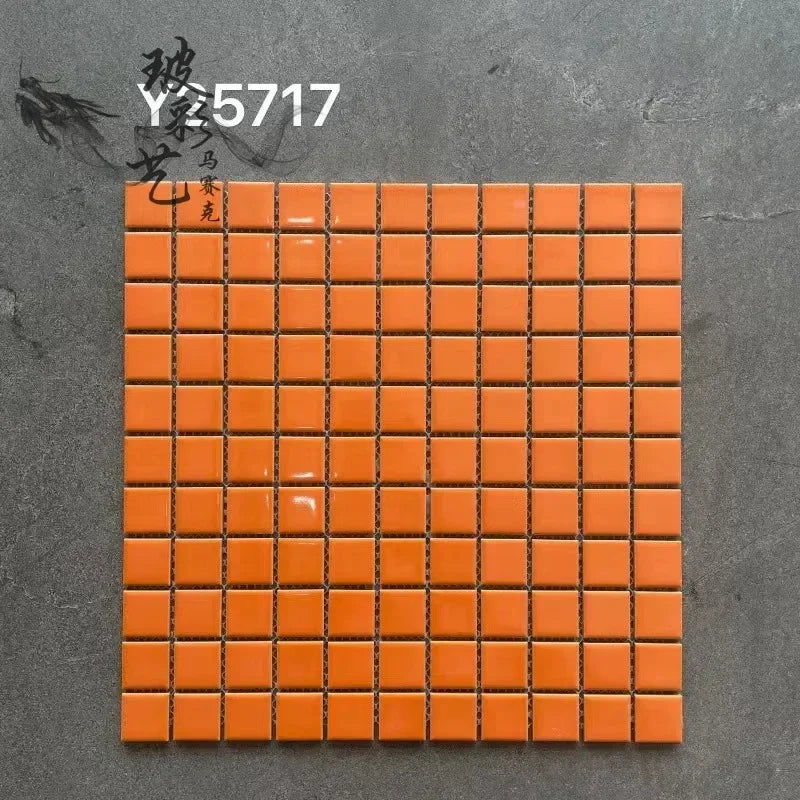 Ceramic mosaic wall tiles sheet with glossy orange squares and dark grout lines