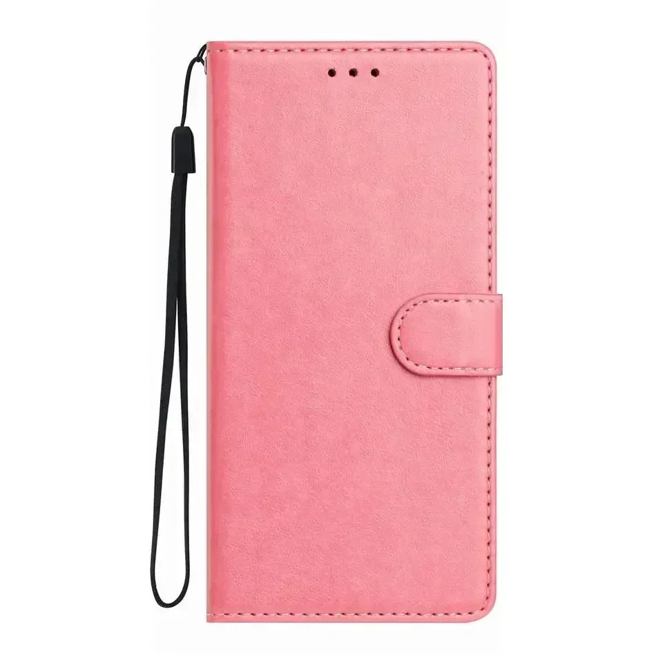 Pink leather wallet phone case with a magnetic strap and black wrist lanyard.