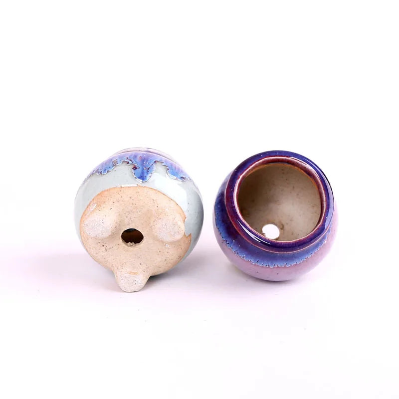 Mini ceramic flowerpot for succulent, white-blue glaze with red rim, drainage hole on base.