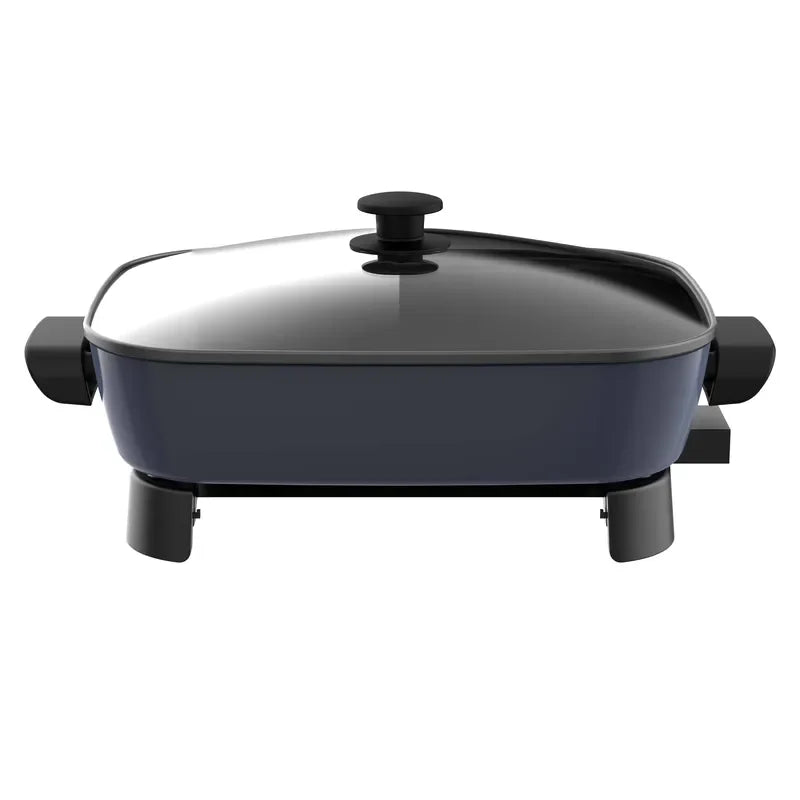 Electric nonstick frying pan with dark lid, top knob, and side handles on legs