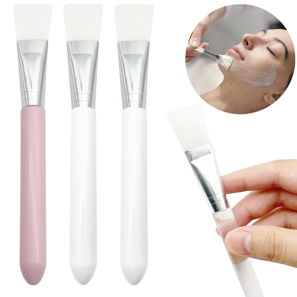 Silicone face mask brushes with soft, white flexible tips, silver ferrules, and smooth pink or white handles.