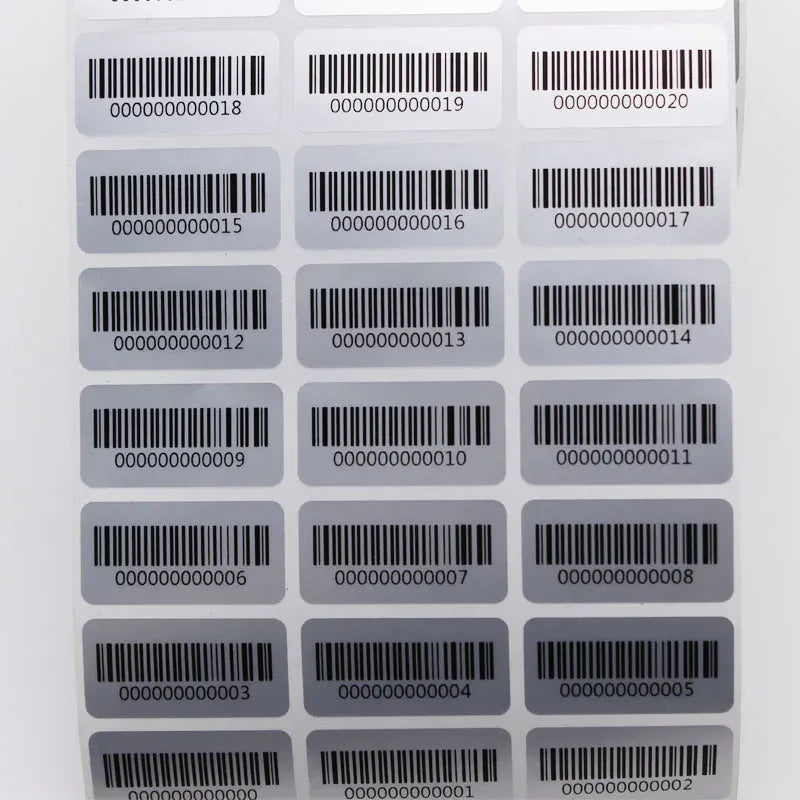 Barcode inventory stickers on a sheet, white labels with black bars and numbers
