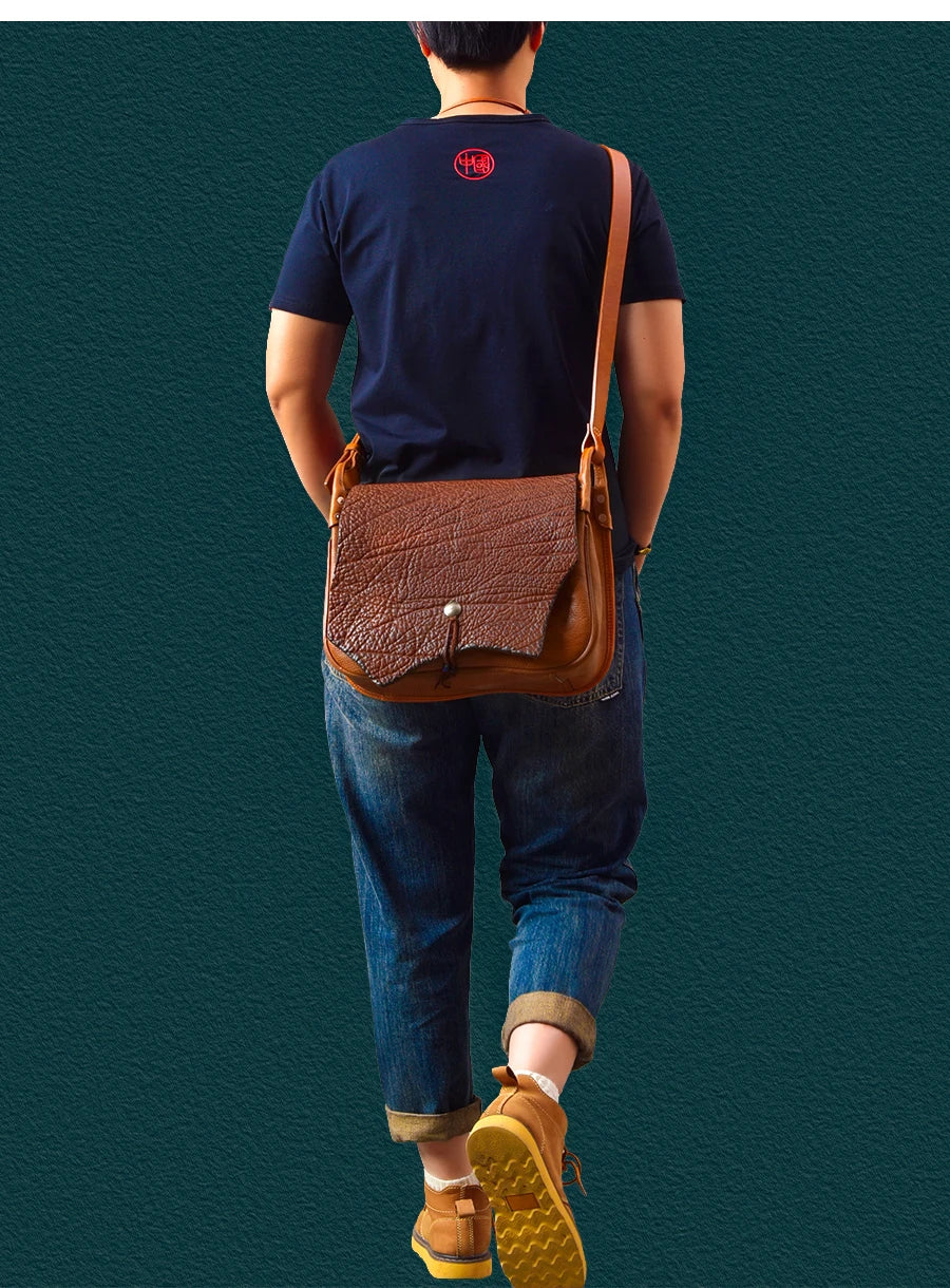 Vintage handmade brown genuine cowhide messenger bag with textured flap and crossbody strap for casual travel.