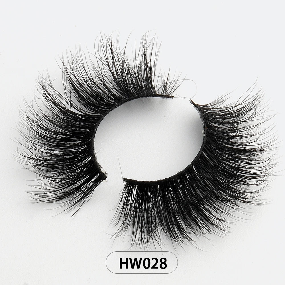 Black 3D mink false eyelashes with a full, voluminous, wispy design and a flexible band against a white background.