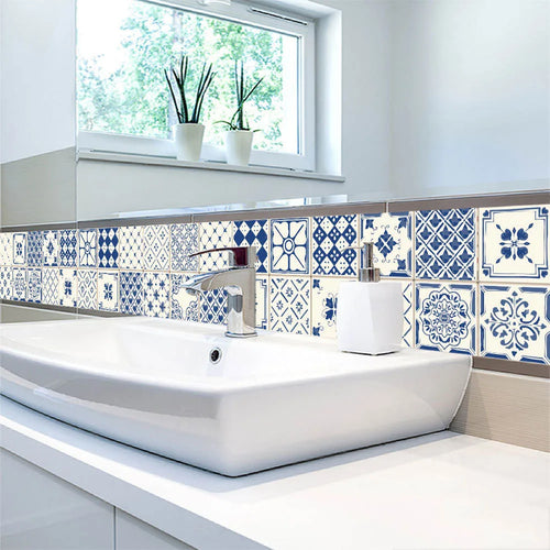 Blue and white waterproof tile-pattern wall stickers covering a bathroom backsplash