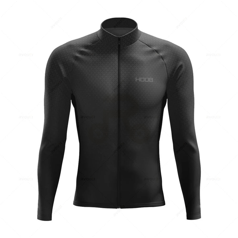 Tidesmit black long-sleeve thermal cycling jersey with a full-front zip, high collar, and subtle geometric pattern.