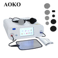 White radiofrequency skin tightening machine with a digital screen, metal applicators, and a flat grounding plate.