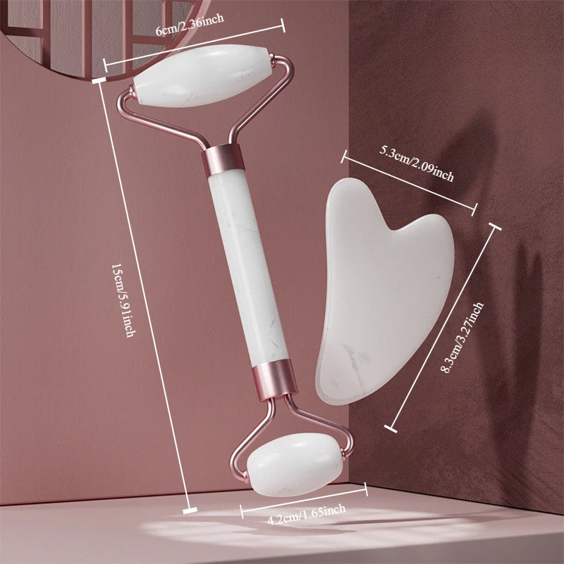 White marble face massage roller and heart-shaped gua sha board with rose gold accents, displayed with dimensions.