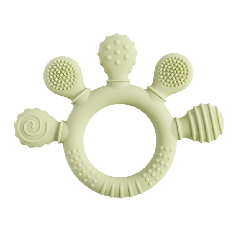 Sage green silicone teething ring toy for baby teething relief.