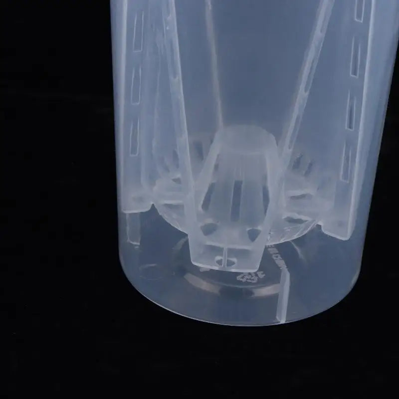 Close-up of transparent plastic planter with bottom self-watering insert
