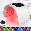 White, arch-shaped LED facial light therapy device with a black control panel and US power plug.