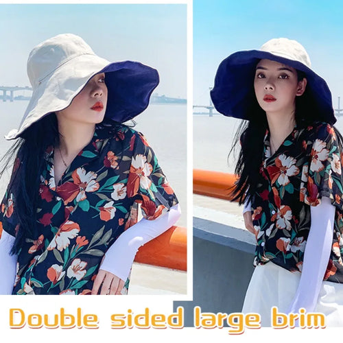 Tidesmit reversible wide-brim sun hat in beige and navy blue, showing a soft fabric, floppy shape, and UV protection.