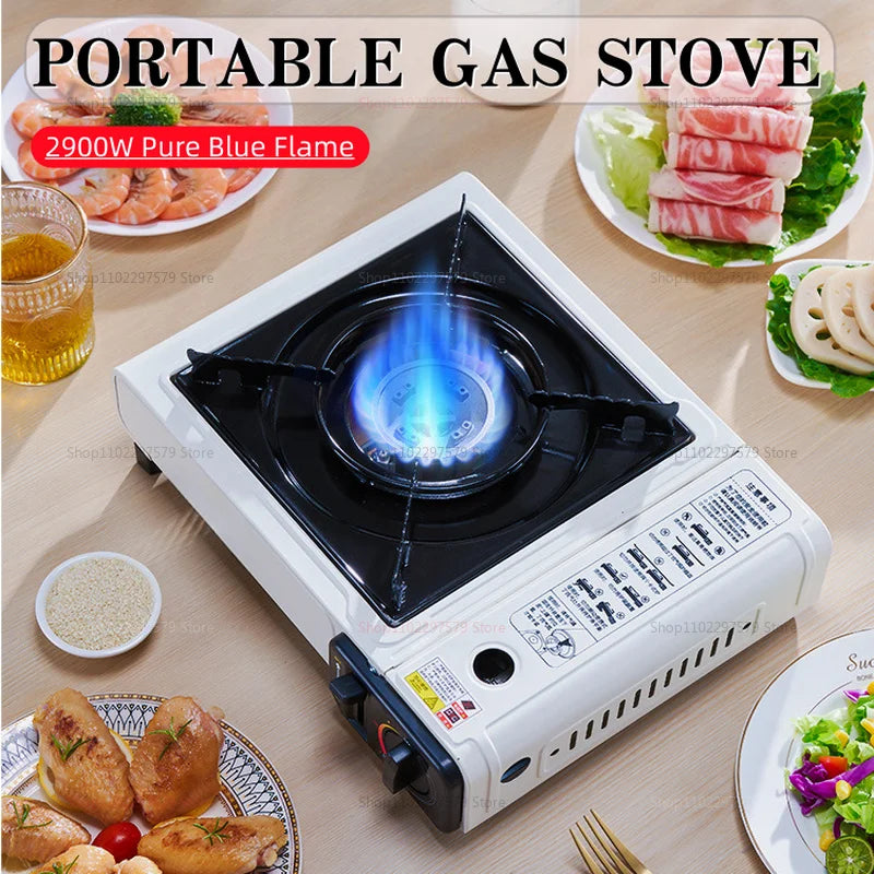 Portable gas stove with blue burner flame and black grate on a white base