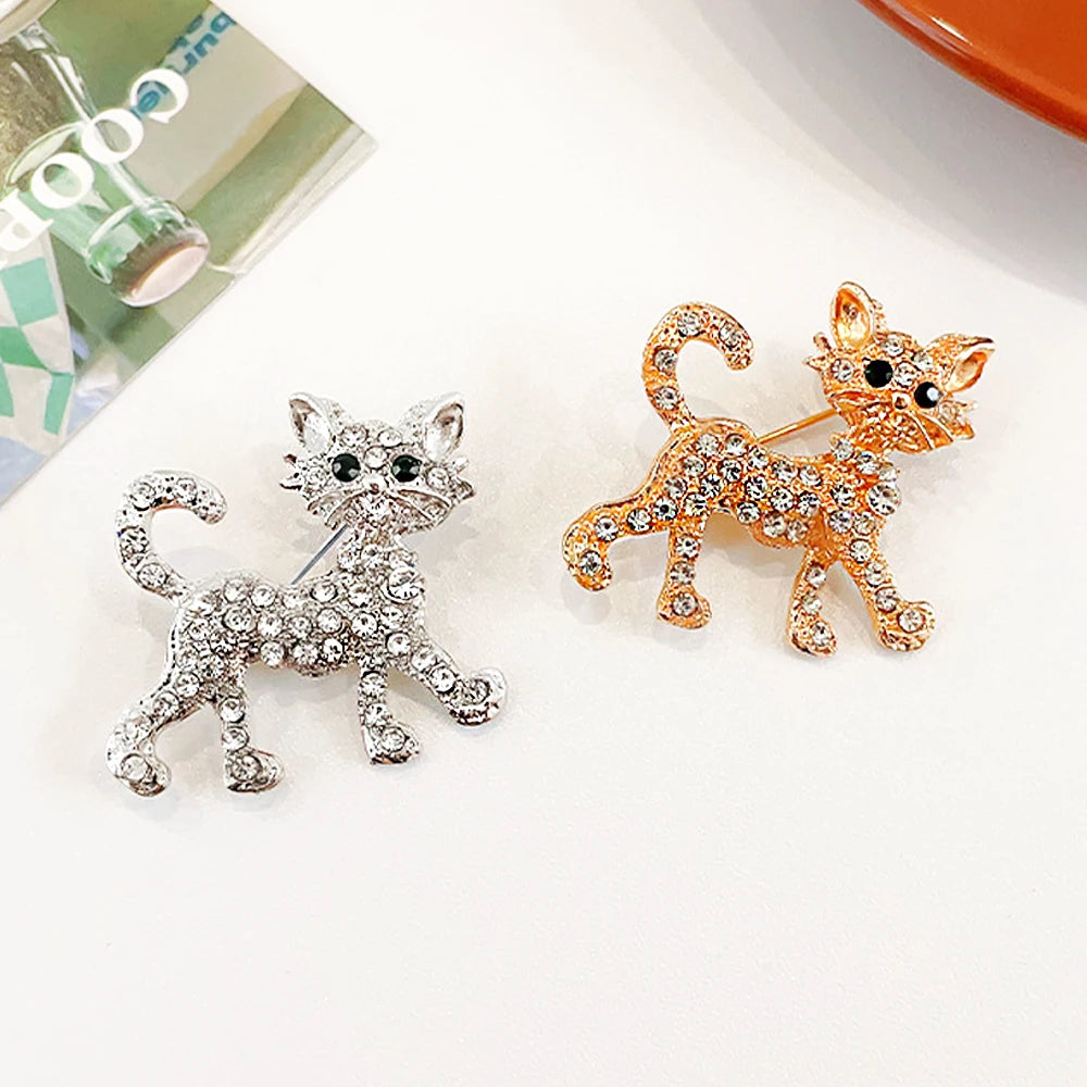 Sparkling silver and gold crystal cat brooches, perfect fashion lapel pin gifts for pet lovers and cat owners.