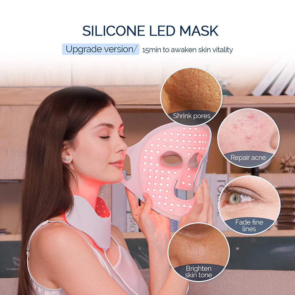 A woman wears a flexible silicone LED facial and neck mask emitting red light for skin therapy.