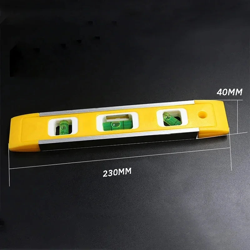 Yellow level tool with two bubble vials for checking straightness