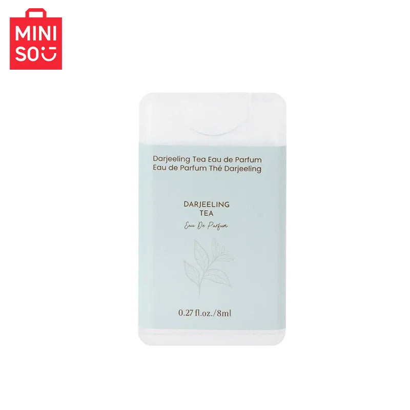 MINISO Darjeeling Tea EDP for men: 8ml portable woody fragrance in a slim, rectangular white travel spray bottle.