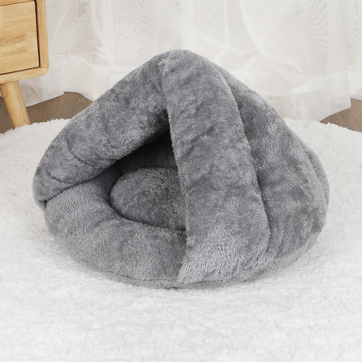 Cozy gray plush dog bed cave, a washable self-warming sofa for small dogs and cats to sleep comfortably.
