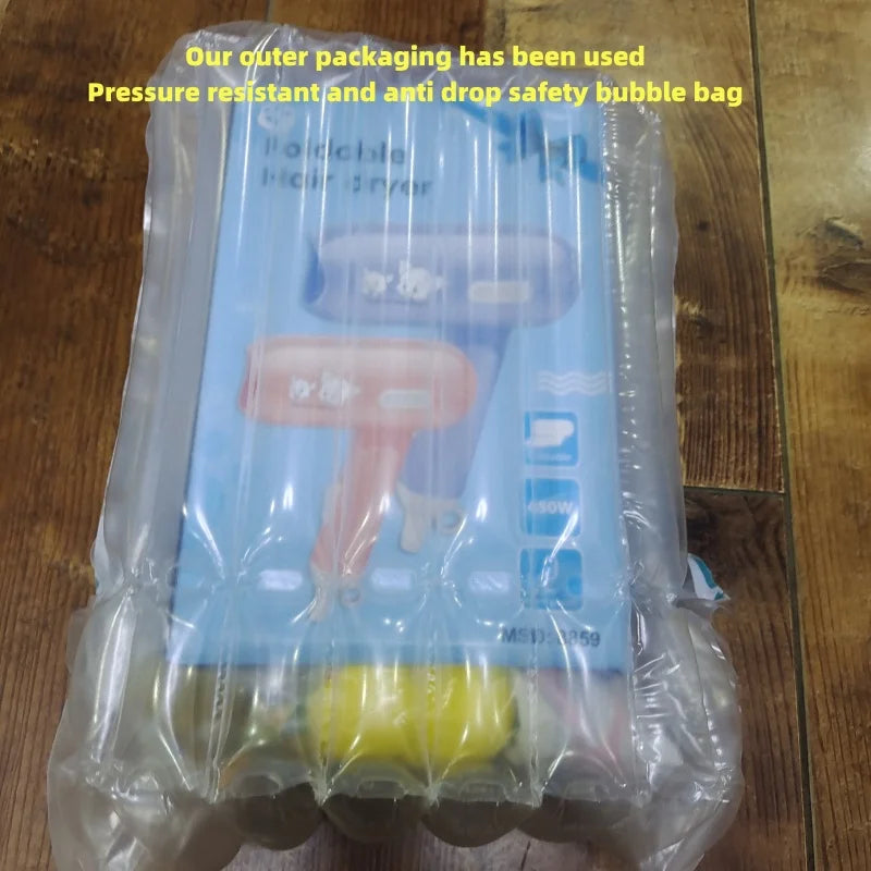 Mini 400W foldable hair dryer in protective bubble wrap packaging, ideal for travel and dorm use.