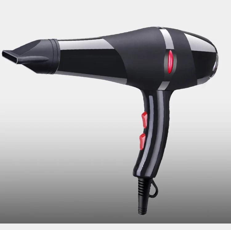 Black 2100W professional AC salon hair dryer with concentrator nozzle, red speed controls, and ergonomic handle.