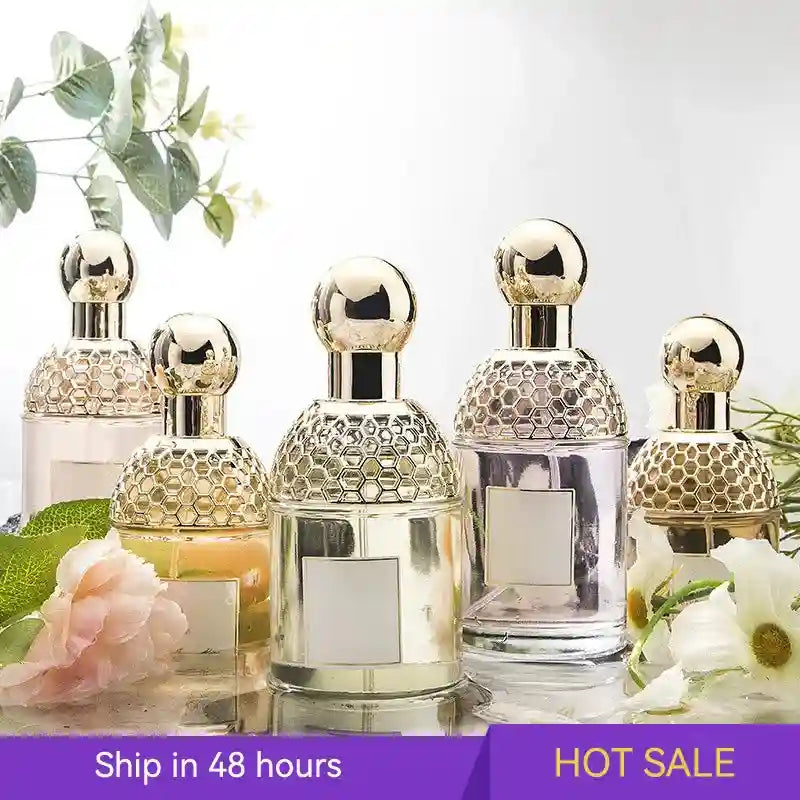 Flora Water women’s EDT: Floral fruity, long-lasting summer perfume in honeycomb glass bottles with gold sphere caps.