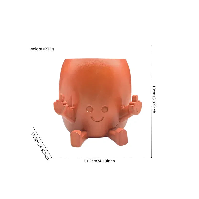 Mini hanging succulent planter, orange face with arms and hanging loop handles; shown with size.